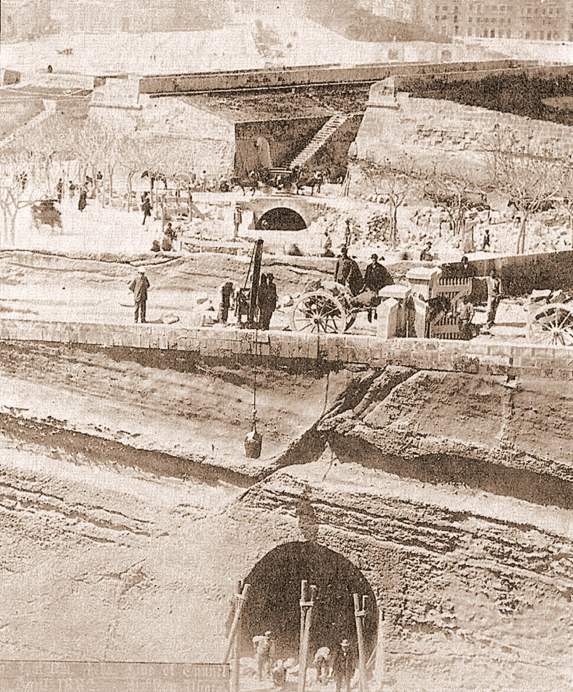 An official photo dated April 1882, intended to reassure London investors that work was progressing well on the railway. The lower portal is the train tunnel, whilst the arch beyond carries the Floriana road across the cut-and-cover section.