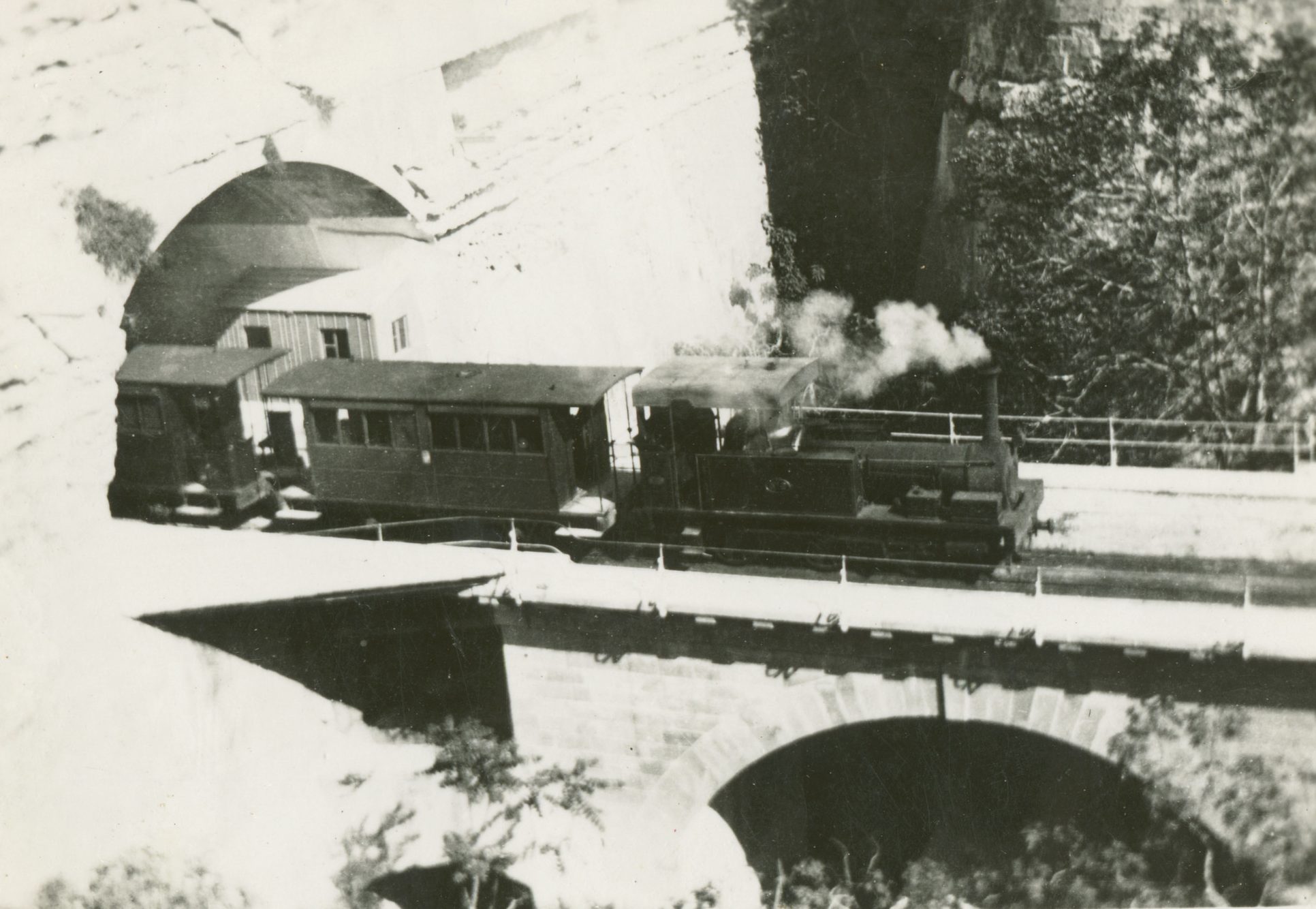 The original timber bridge outside Valletta station decayed so quickly it had to be condemned and replaced in stone just eight years after the railway opened. Here, engine No.2 sets-off towards Hamrun across the recently-rebuilt structure after the Government had taken over the railway as a going concern, but before 1896 when the bridge was widened.
