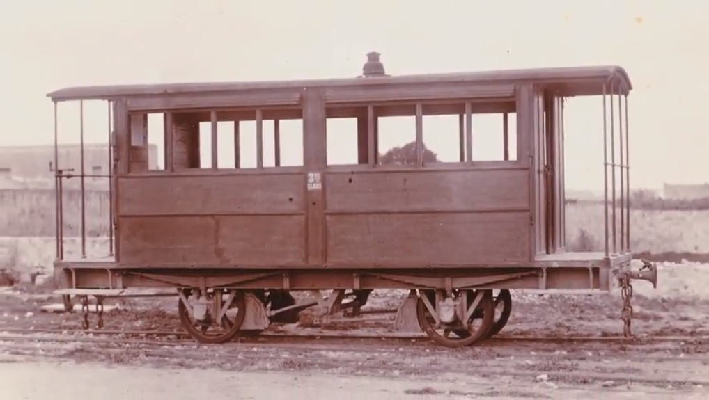 A third class carriage in its original varnished teak livery, impounded by creditors at Hamrun station after the collapse of the Malta Railway Company. This was one of several photographs commissioned ahead of auction.