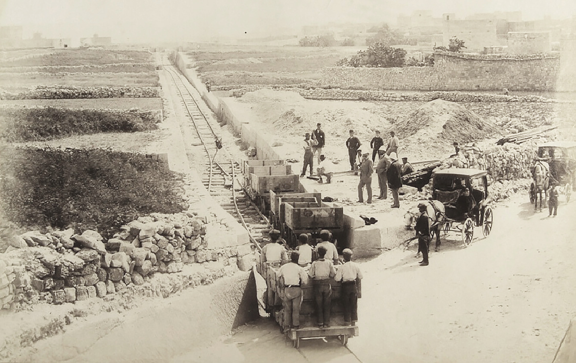 The crossing with the Mosta Road on the outskirts of Attard shows the view back down the line towards Attard, again in April 1882. The photographer's focus on this stretch of track, with three different angles taken of it, would tend to support accusations that it was one of the only sections of the railway in a near-complete condition.