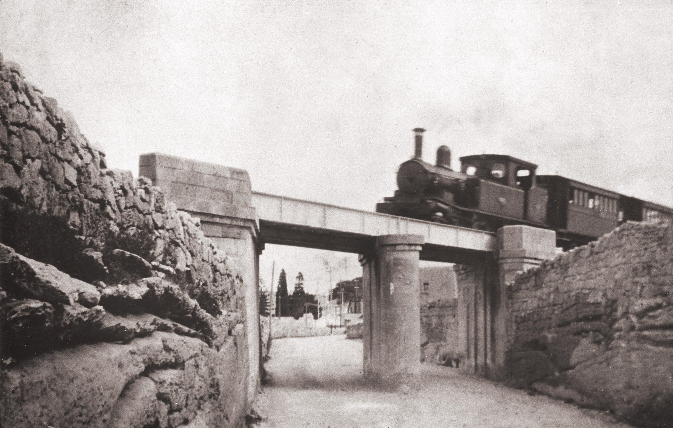 The viaduct at Attard was the scene of a fatality when a company employee fell from the unprotected bridge abutment. The road here was dug into the rock to create headroom below the line to the railway.