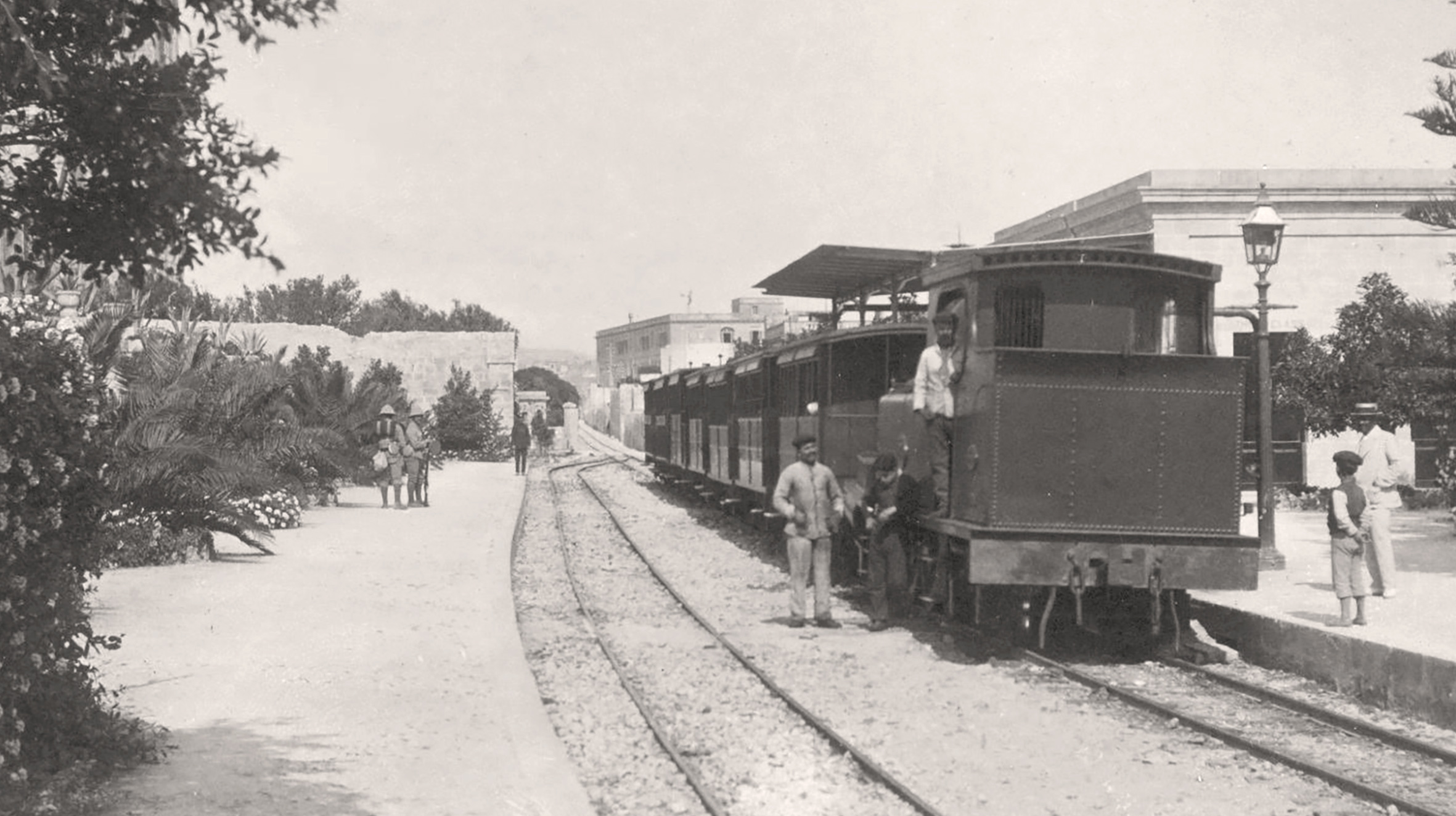 Looking along the length of the new platforms at Birkirkara in about 1915, a few years after it was completed. Trees just showing on the left were retained from the earlier planting and so mark the end of the platform before it was extended westwards. (courtesy Malta Study Circle)