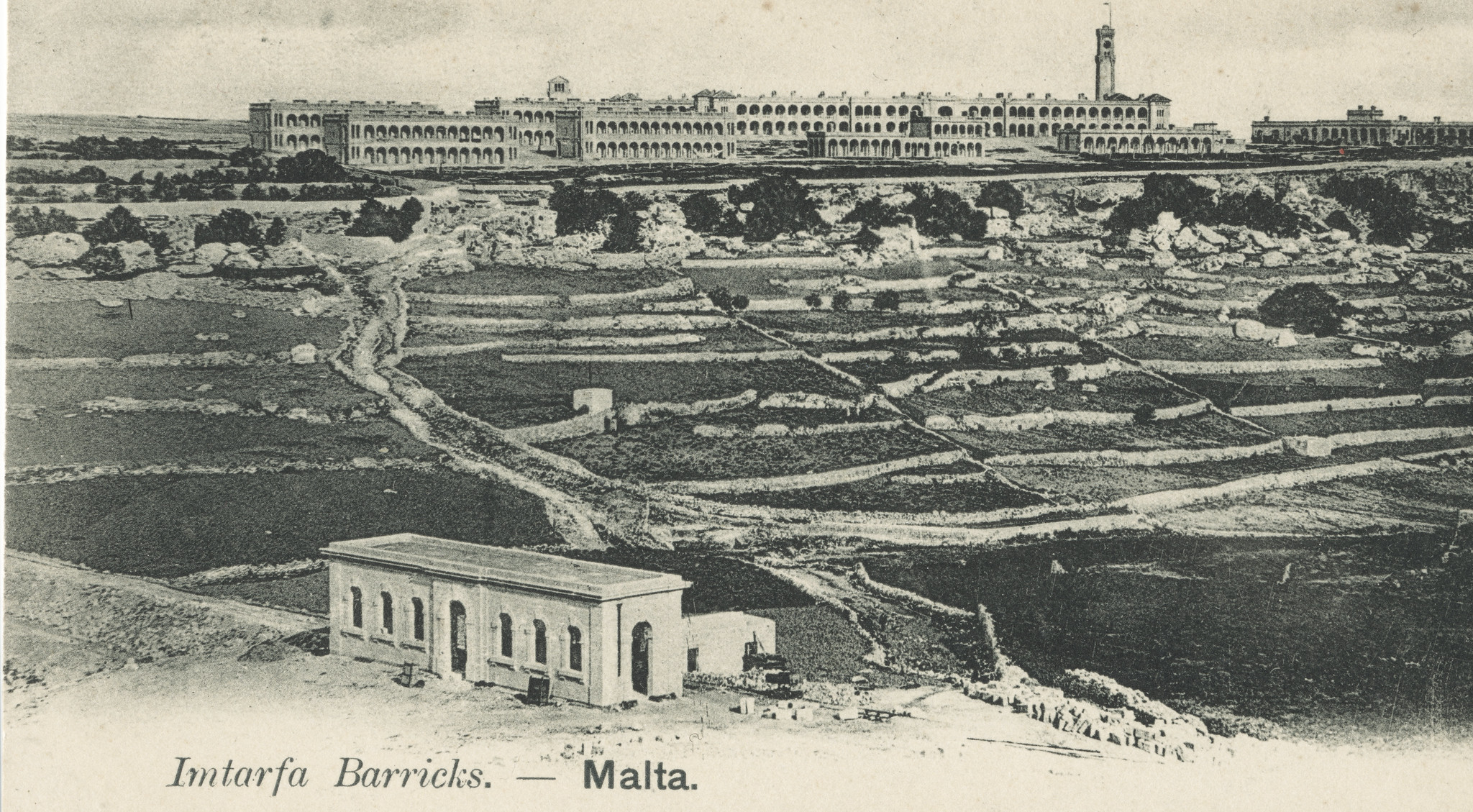 A rare view of the Mtarfa extension during construction. Museum station building stands complete, but missing a platform, track, and with the embankment a fraction of it's required width. The raison d'être of a station here, Mtarfa Barracks, dominates the skyline beyond. circa 1899.