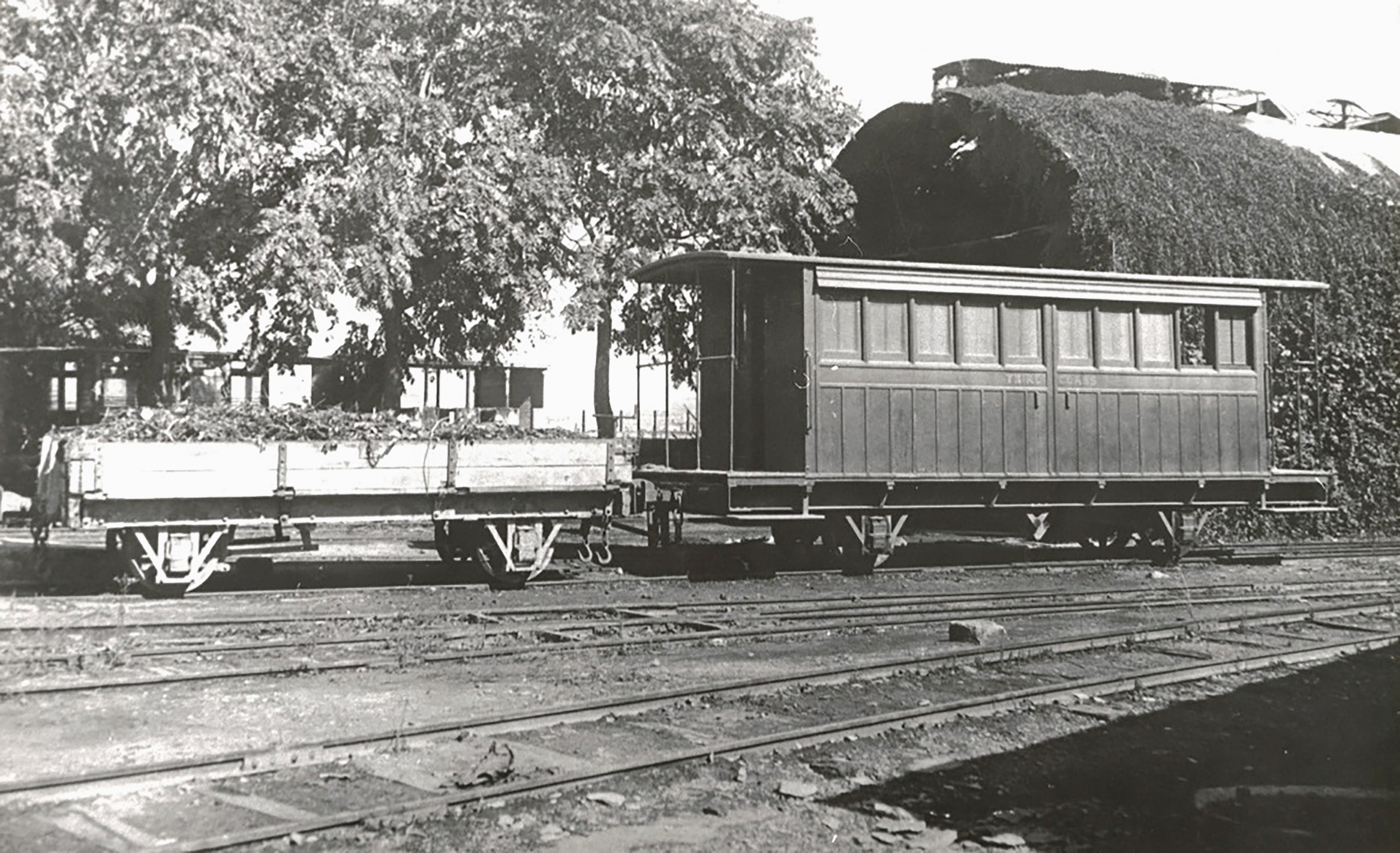 Another photo taken in 1933 ahead of the attempted sale of rollingstock. An example of a ballast wagon and one of the second-generation 3rd Class carriages is recorded outside the original carriage shed at Hamrun. The corrugated iron roof of the shed is in a deplorable rusted condition allowing rain and rust to shower down inside.