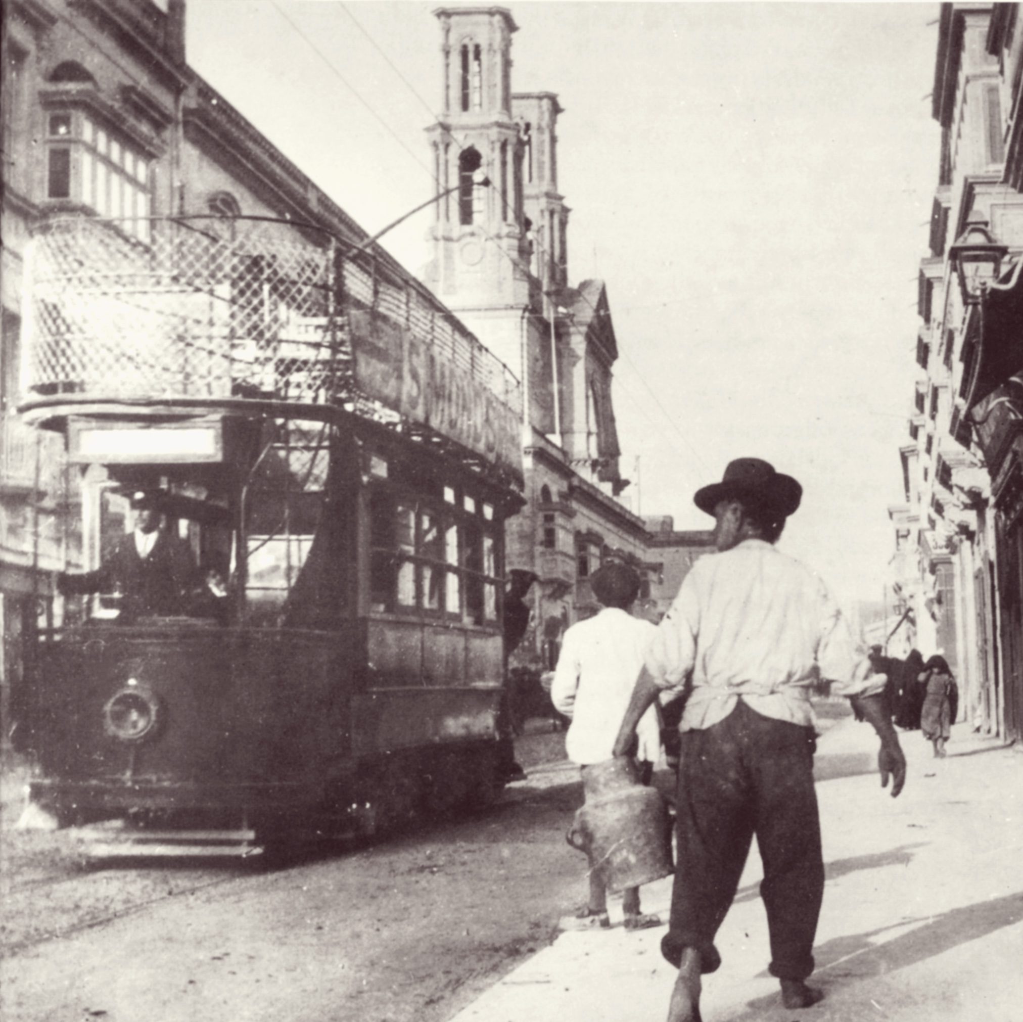Not long after opening in 1905, a Malta Tramways Co tramcar trundles down St Joseph High Street, Hamrun. Although the railway station was only 150 feet from the High Street, many found the tram more convenient and cheaper.