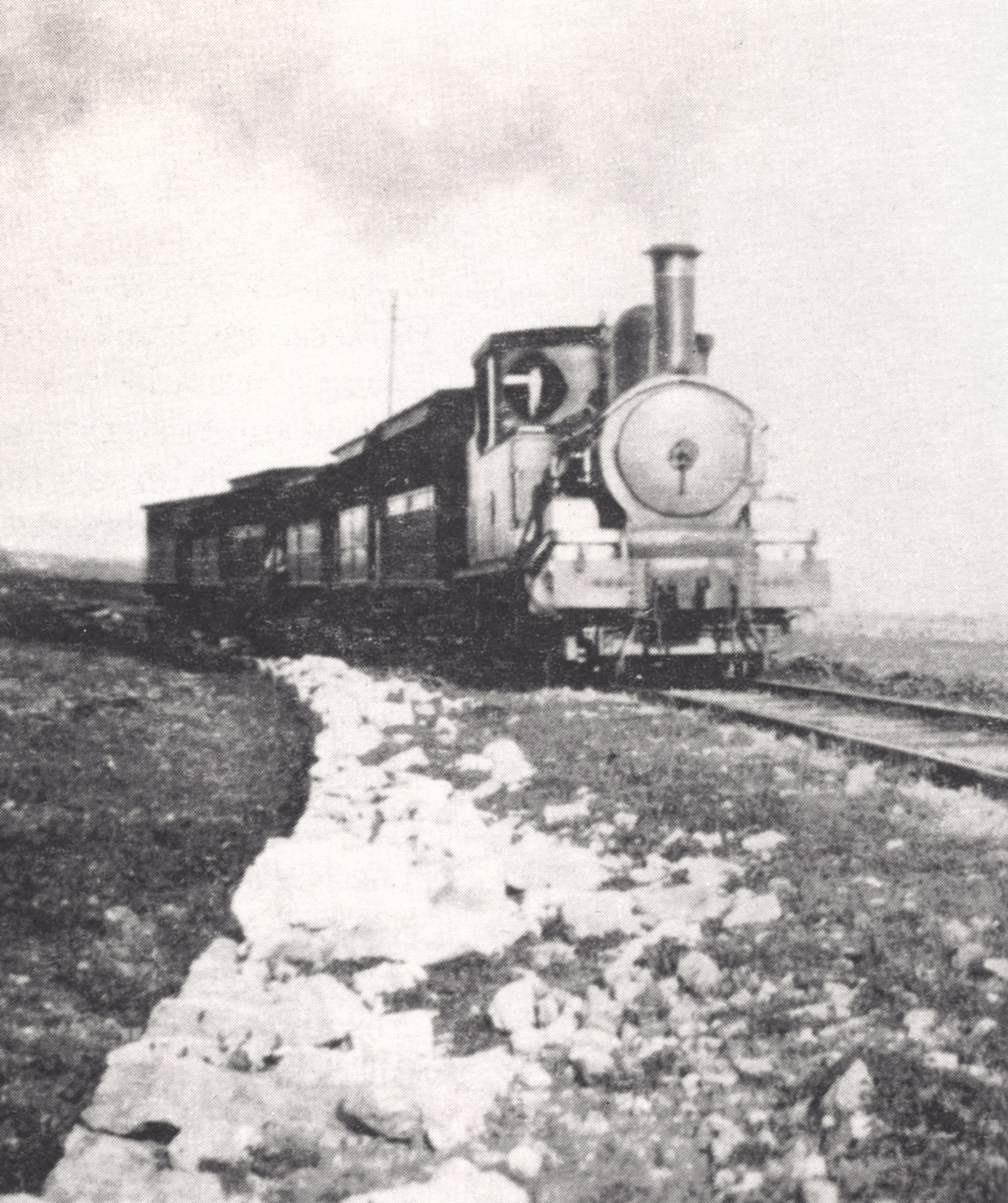 A lonely scene with a typical Malta Railway train passing through an agricultural landscape nearing San Salvatore.