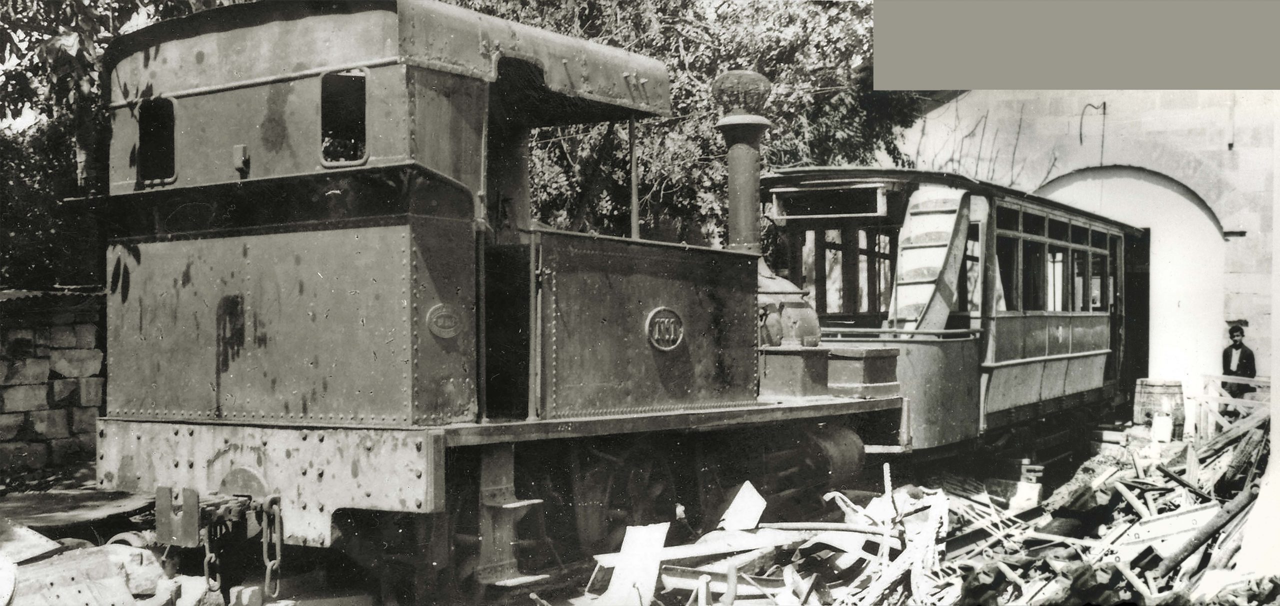 Derelict railway engine outside the old Hamrun engine shed surrounded by scrap