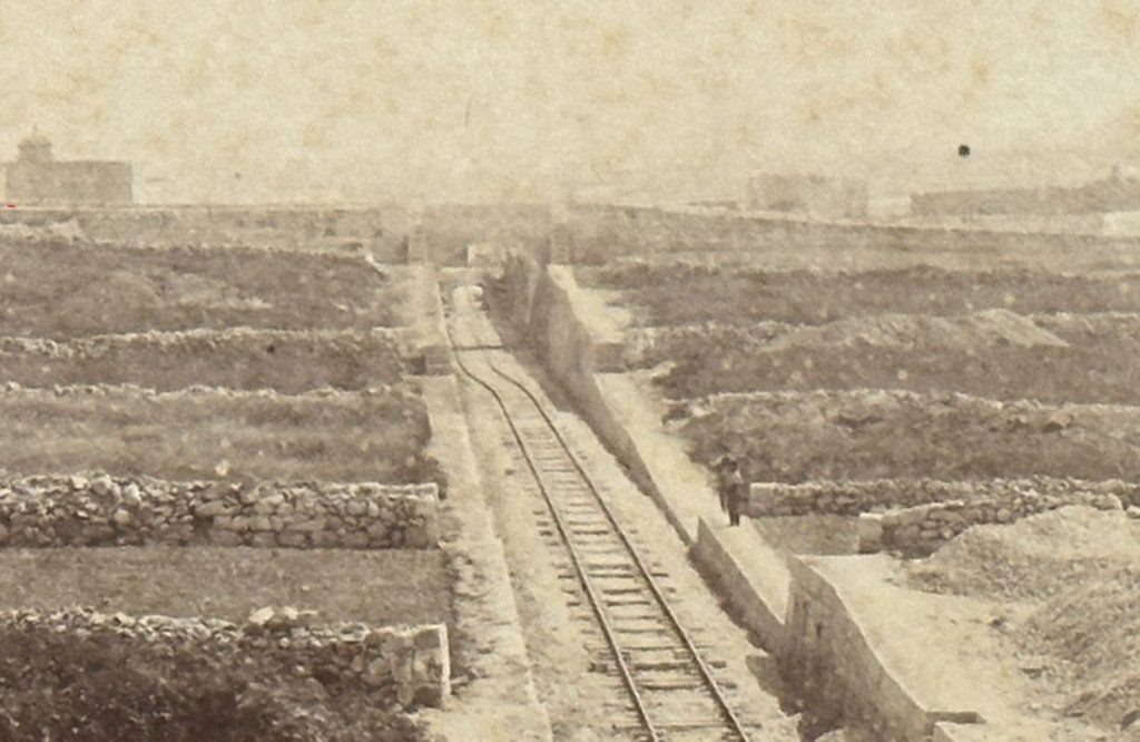 
Detail focussing on the bridge in the far distance of the previous photo, and showing what appears to be two bridges crossing the line near Attard. 